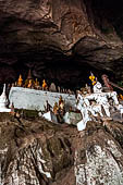 Luang Prabang, Laos - The Pak Ou Caves, the lower cave called Tham Ting. The caves, a Buddhist pilgrimage site, are a repository of old Buddha statues. 